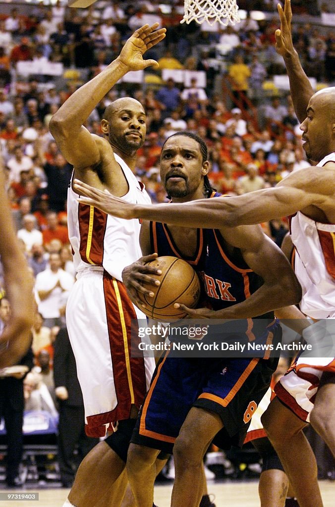 New York Knicks' Latrell Sprewell is hemmed in by Miami Heat