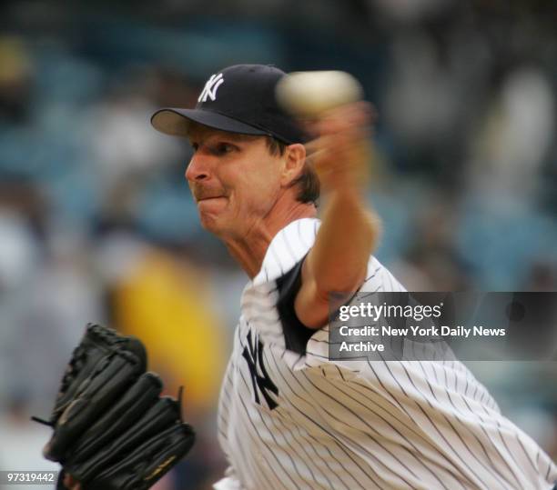 New York Yankees' starting pitcher Randy Johnson delivers home during a game against the Baltimore Orioles at Yankee Stadium. Johnson led the Yanks...