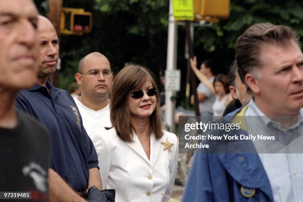 Judith Nathan, the mayor's girlfriend, is a well-protected face in the crowd at the 91st annual Travis Fourth of July Parade on Staten Island.