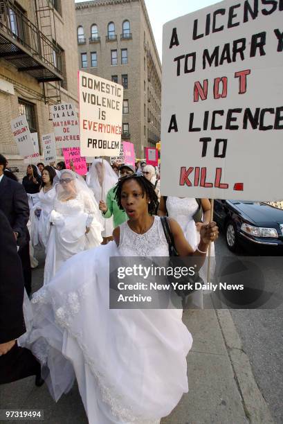 Members of the New York Latinas Against Domestic Violence wear wedding dresses as they participate in the NYC Annual Brides? March Against Domestic...