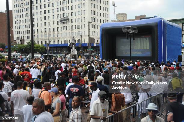 Michael Jackson Remembered in Harlem by his many fans who laughed and cried while watching his funeral service on big screen TV front of State Office...
