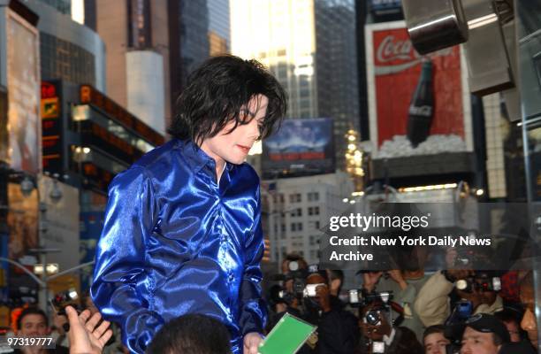 Michael Jackson steps outside to greet the crowd during what was billed as his first in-store appearance at the Virgin Megastore in Times Square.
