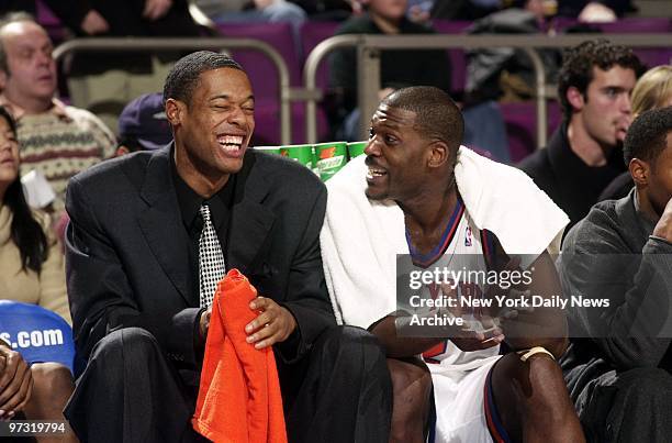 New York Knicks' Marcus Camby and Larry Johnson share a laugh on the sidelines at the end of game against the Chicago Bulls the Madison Square...