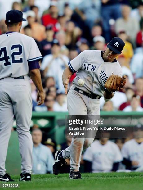New York Yankees' third baseman Alex Rodriguez nearly bobbles a pop fly hit by Boston Red Sox's Tony Graffanino, but recovers it, in the ninth inning...