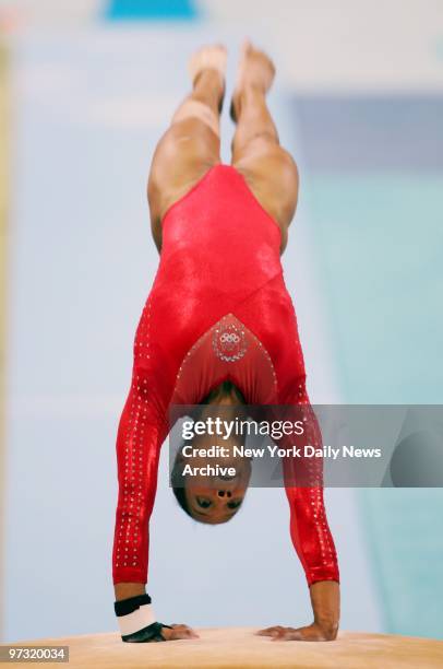 Gymnast Annia Hatch is on her way to winning a silver medal in the vault at the 2004 Summer Olympic Games in Athens.