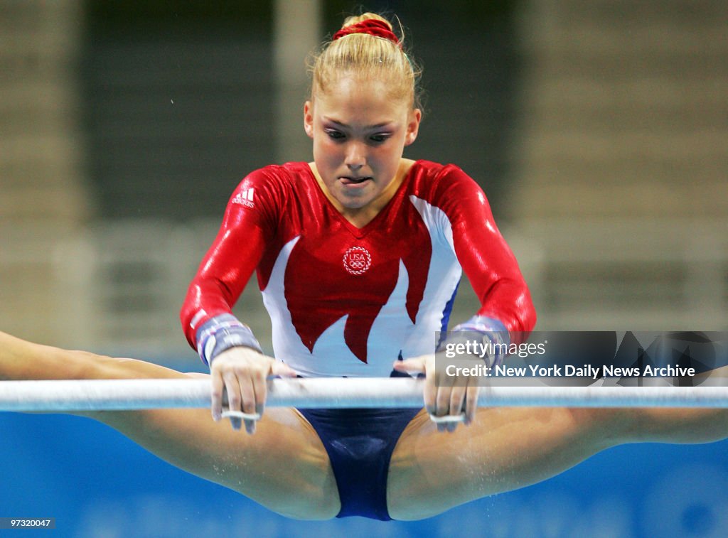 U.S. gymnast Courtney McCool competes on the uneven parallel