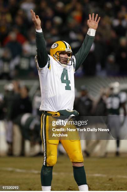 Green Bay Packers' quarterback Brett Favre signals a score after throwing a 14-yard pass for a touchdown in the second quarter against the New York...