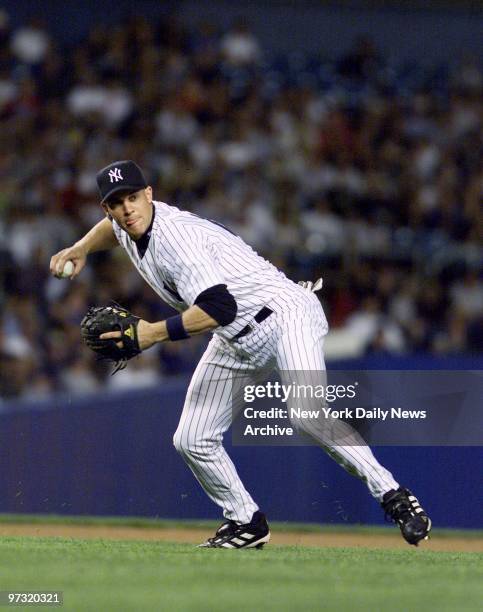 New York Yankees' third-sacker Clay Bellinger throws out the Tampa Bay Devil Rays' Jason Tyner in the first inning at Yankee Stadium. After a...