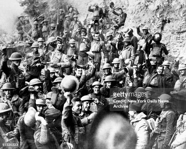 Members of the Sixty-Fourth Regiment Infantry, Seventh Division, cheer upon hearing the news of the signing of the Armistice.