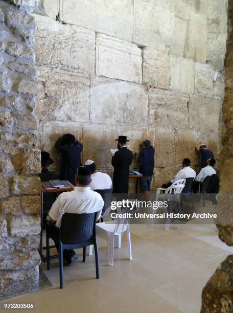 Jews praying inside the Prayer Hall. A covered section of the Western Wall Plaza. Jerusalem. Israel.