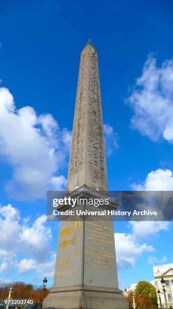 At the center of the Place de la Concorde. Paris is a giant Egyptian obelisk decorated with hieroglyphics exalting the reign of the pharaoh Ramses...