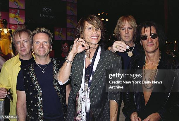 Steven Tyler and other members of the rock band Aerosmith holds keys to a new Dodge Ram at Cipriani 42nd St. The band was on hand to announce its new...