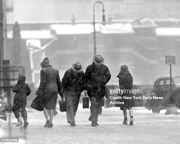 Greetings from Jack Frost howled into town on a 50 m.p.h. Gale. Here are some of New Yorkers battling the snowstorm.