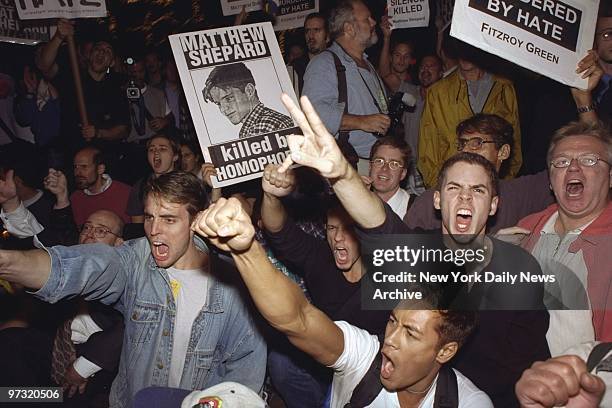 Demonstrators protest hate killing of gay student Matthew Shepard.