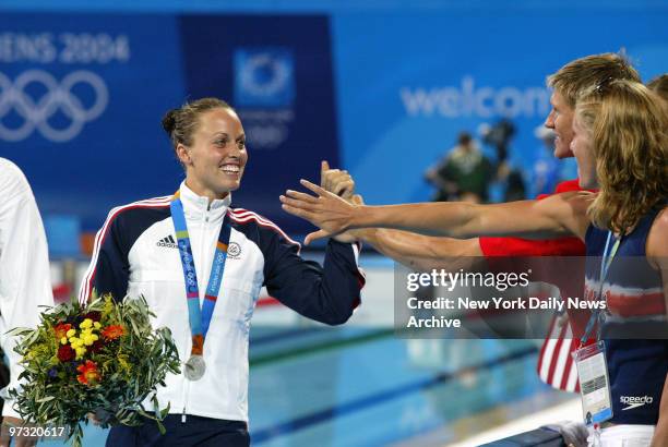 Swimmer Amanda Beard is congratulated on her silver medal win in the 200-meter individual medley at the 2004 Summer Olympic Games.