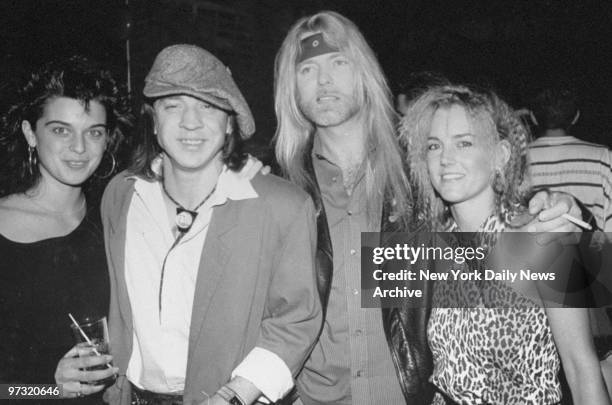 Stevie Ray Vaughn with Jeanna Lapites and Gregg Allman with friend Pam Cagle relax at the Tunnel after concert.