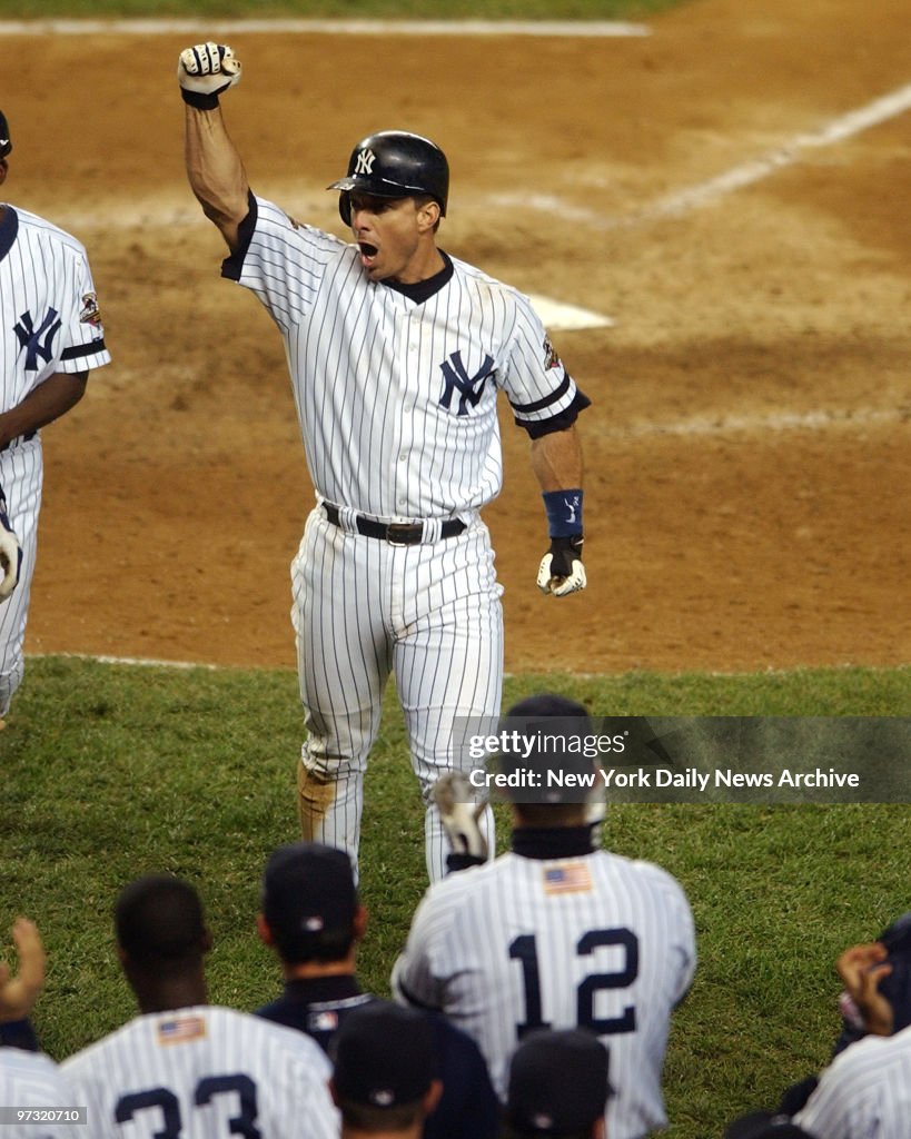 New York Yankees' Tino Martinez raises his fist in celebrati