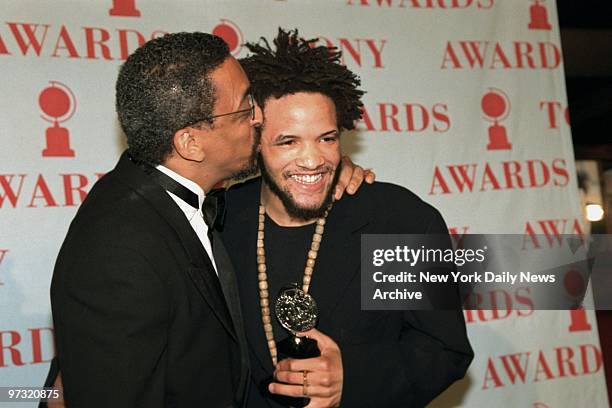 Gregory Hines gives a congratulatory kiss to Savion Glover after Glover won a Tony awards for best choreographer.