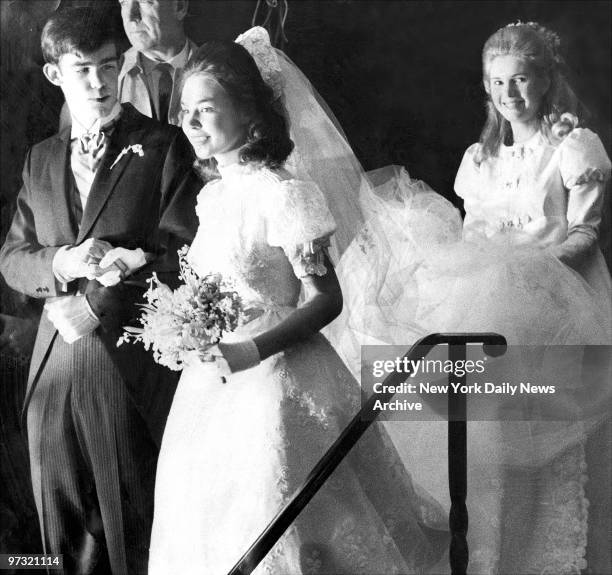 Julie and David Eisenhower leaving Marble Collegiate Church with Tricia Nixon, maid of honor, following their wedding