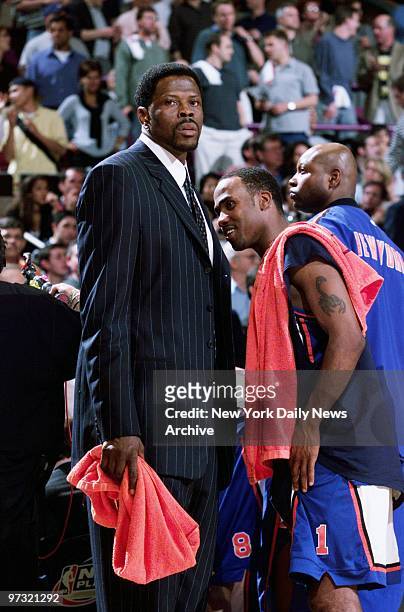 New York Knicks' Patrick Ewing, sidelined with an injured foot, looks on as the Knicks defeated the Indiana Pacers in Game 4 of the NBA Eastern...