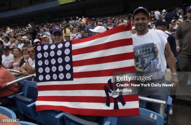 New York Yankees vs Boston Red Sox.Fans with flag denoting yankee championships.