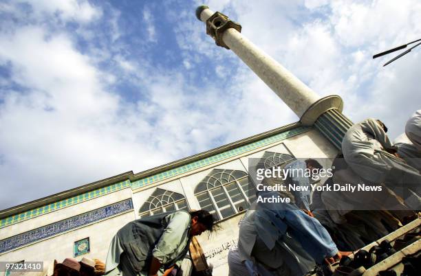 Men attend a Friday prayer service at the Blue Mosque in Kabul, Afghanistan.
