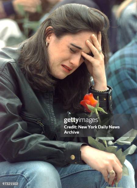 Grieving student weeps outside Columbine High School in Littleton, Colo., where two teenagers shot to death 12 students and a teacher before killing...