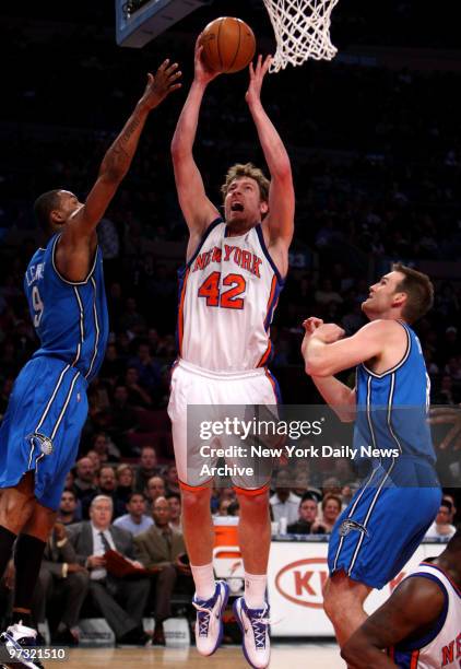 New York Knicks vs. Orlando Magic at Madison Square Garden. 1st half, New York Knicks forward David Lee defended by Orlando Magic forward Rashard...