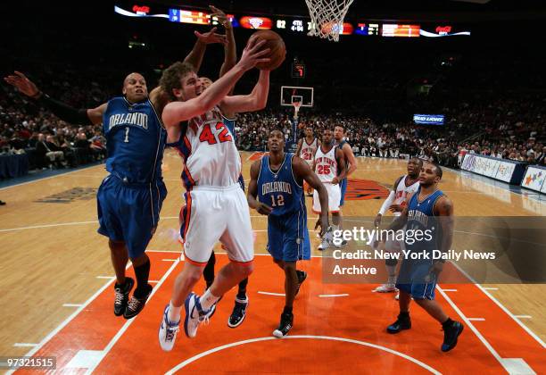 New York Knicks vs. Orlando Magic at Madison Square Garden. 2nd half, New York Knicks forward David Lee defended by Orlando Magic guard Maurice Evans.