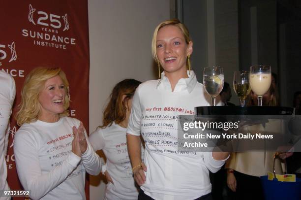 Uma Thurman shows off her waitressing skills as Glenn Close applauds while at the Metropolitan Pavilion to celebrate the 25th anniversary of the...