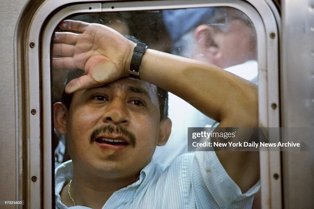 Straphagger Straphanger is pressed against subway car window by crowds at the ...