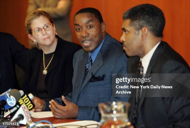 New York Knicks' president Isiah Thomas speaks to the media with his attorneys, Sue Ellen Eisenberg and Steve Mills, at their midtown office. Thomas...