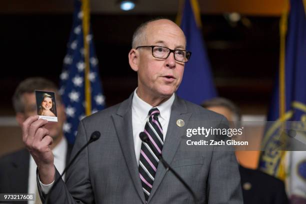 House Energy and Commerce Committee Chairman Rep. Greg Walden holds up a photograph of Amanda Beatrice Rose Gray, who passed away from an opioid...