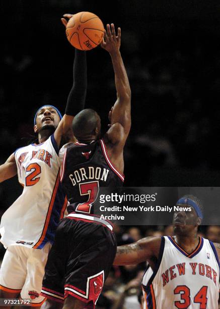 New York Knicks' Renaldo Balkman and Eddy Curry block Chicago Bulls' Ben Gordon during the first half of game at Madison Square Garden. The Knicks...