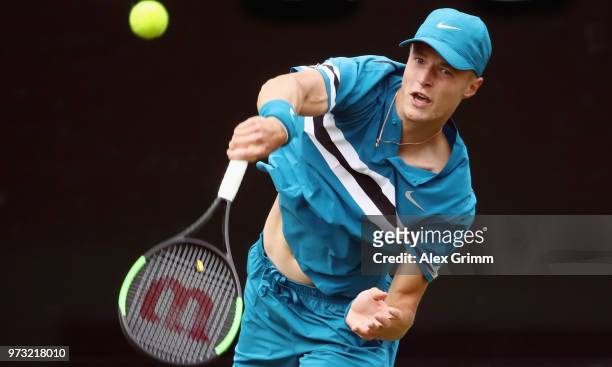 Rudolf Molleker of Germany serves the ball to Lucas Pouille of France during day 3 of the Mercedes Cup at Tennisclub Weissenhof on June 13, 2018 in...