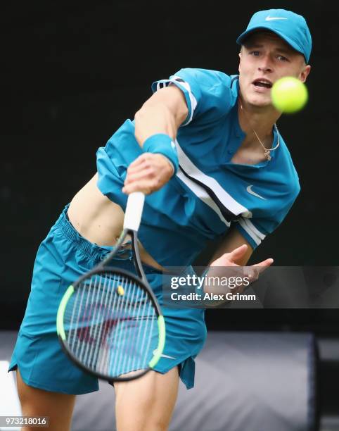 Rudolf Molleker of Germany serves the ball to Lucas Pouille of France during day 3 of the Mercedes Cup at Tennisclub Weissenhof on June 13, 2018 in...