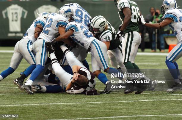 Umpire Bill Schuster falls back onto the turf after being accidentally hit during a run by New York Jets' Leon Washington in the third quarter of a...