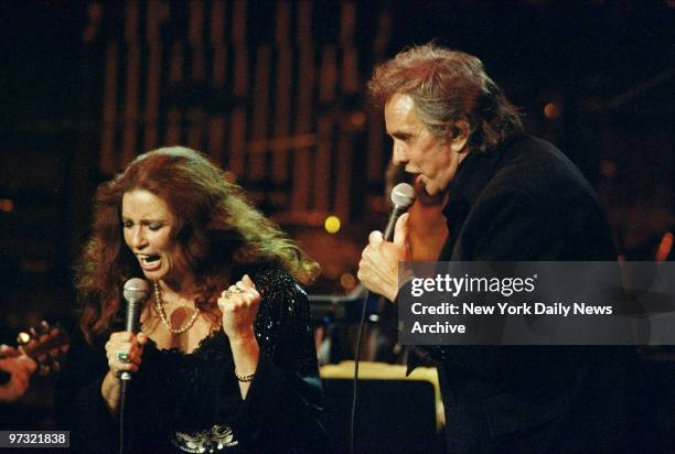 June Carter and Johnny Cash perform in concert at Madison Square Garden.