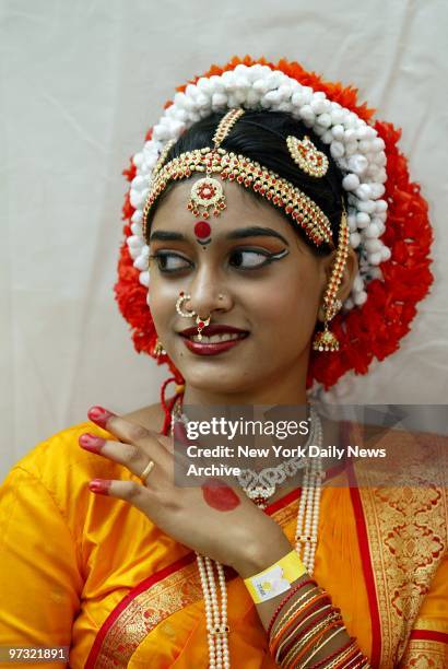 Sumona Chanda of the Indian music and dance school Omna Ancient Art, in Flushing, Queens, is colorfully costumed and decorated at the Indian...