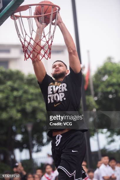 Player Ben Simmons of the Philadelphia 76ers plays basketball with children on June 13, 2018 in Guangzhou, China.
