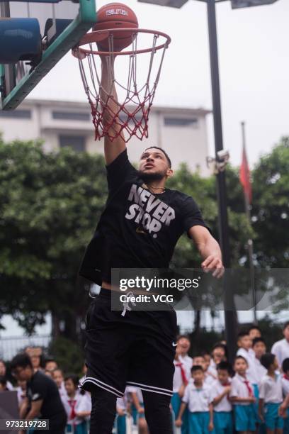 Player Ben Simmons of the Philadelphia 76ers plays basketball with children on June 13, 2018 in Guangzhou, China.