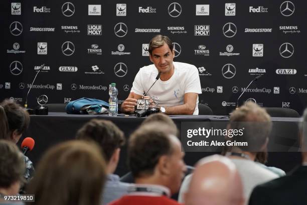 Roger Federer of Switzerland talks to the media after winning his match against Mischa Zverev of Germany during day 3 of the Mercedes Cup at...