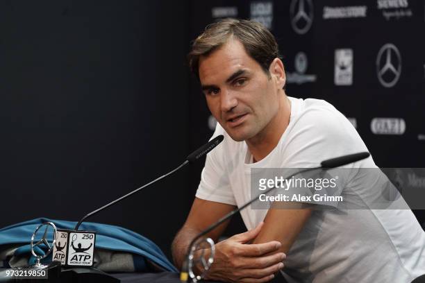 Roger Federer of Switzerland talks to the media after winning his match against Mischa Zverev of Germany during day 3 of the Mercedes Cup at...