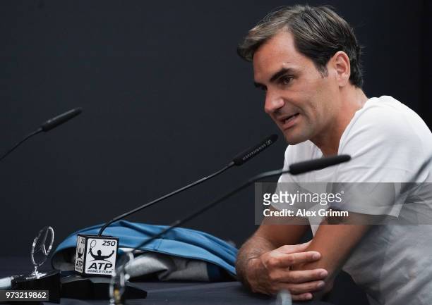 Roger Federer of Switzerland talks to the media after winning his match against Mischa Zverev of Germany during day 3 of the Mercedes Cup at...