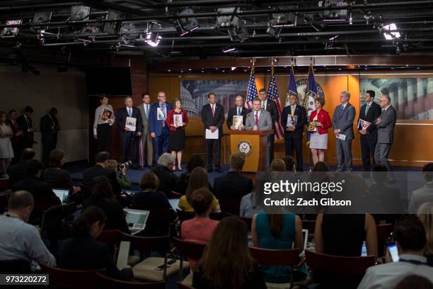 Rep. Buddy Carter speaks as photographs are held up of people affected by the opioid epidemic during a news conference following a Republican...