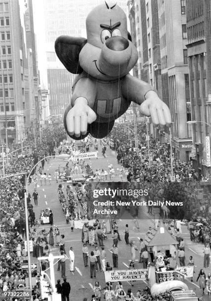 Underdog, floating high above marching bands, floats and ogling eyes, shows he's top dog. There's only one thing that can make a kids forget all...