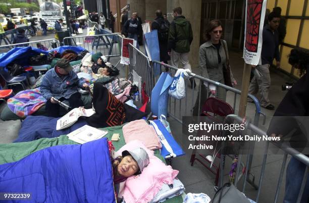 Demonstrators camp out on the sidewalk across the street from Gov. Pataki's Third Ave. Office on the third day of a week-long hunger strike to...