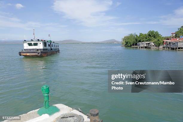 The ferry leaves the Cuban village of Caimanera, heading for Boqueron, located on the other side of the Guantanamo Bay, on June 12 in Caimanera,...