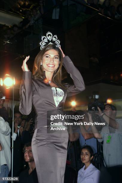 Justine Pasek gets the feel of her new crown after being awarded the Miss Univers title at Trump Tower. Pasek, the former Miss Panama, who finished...