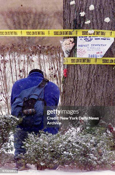 Student kneels at makeshift memorial outside dorm building at Seton Hall University in South Orange, N.J., after blaze that killed three students and...